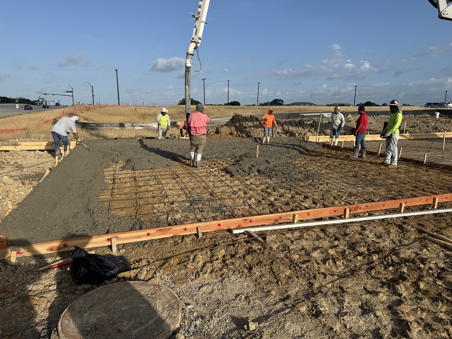 Concrete crew placing a foundation pour