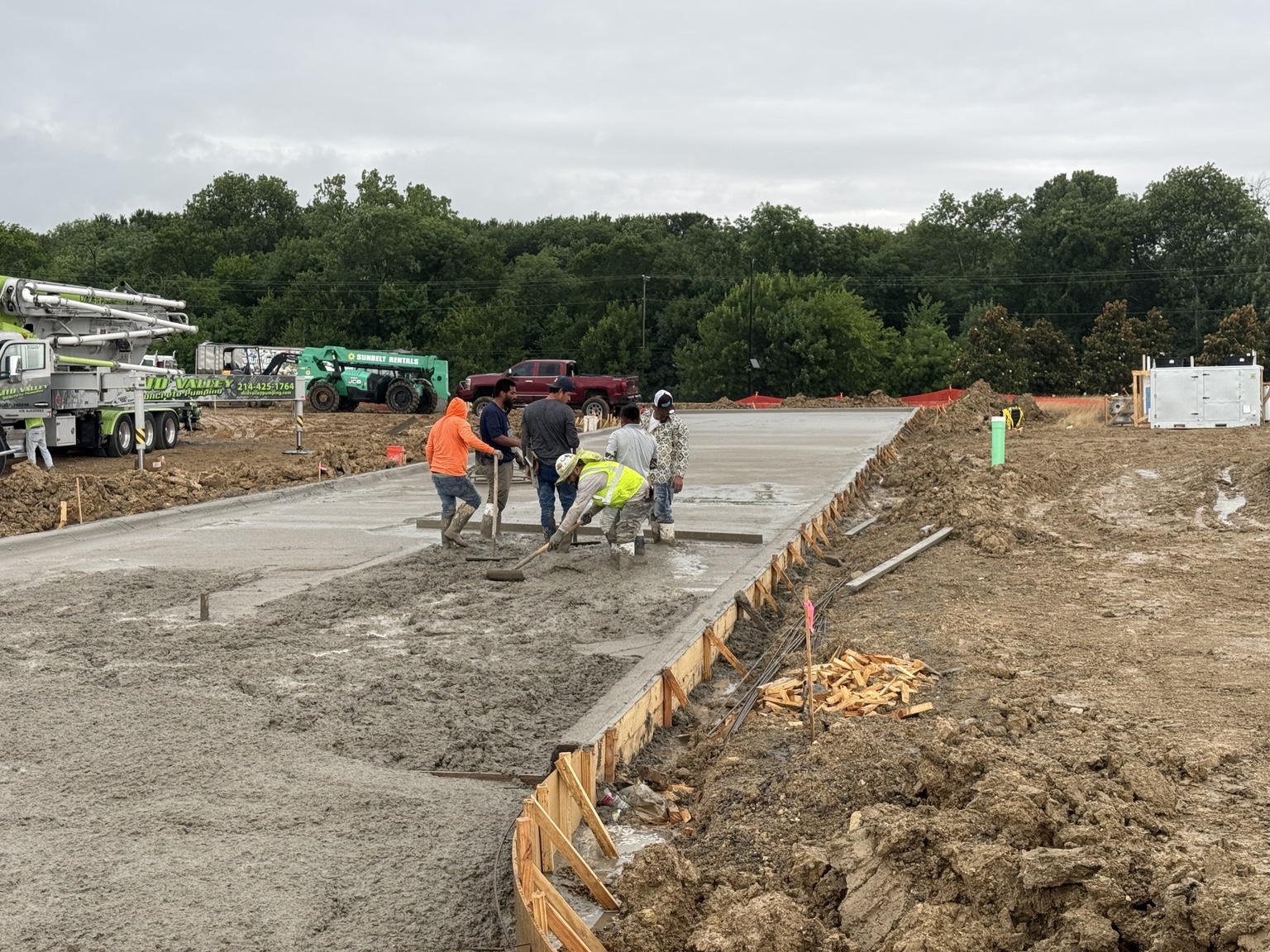 Concrete finish work at an active construction site