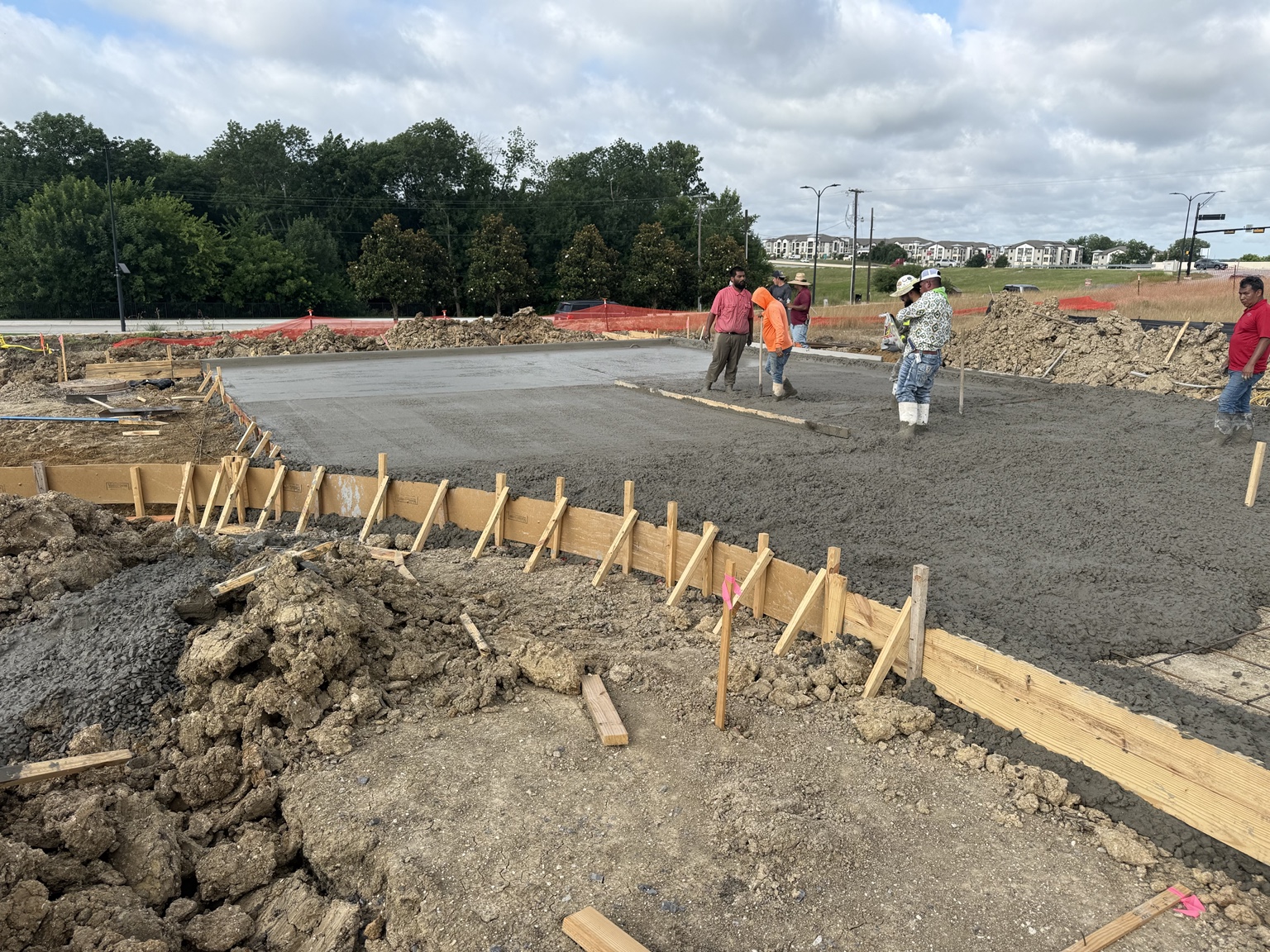 Concrete placement around formed foundation edges